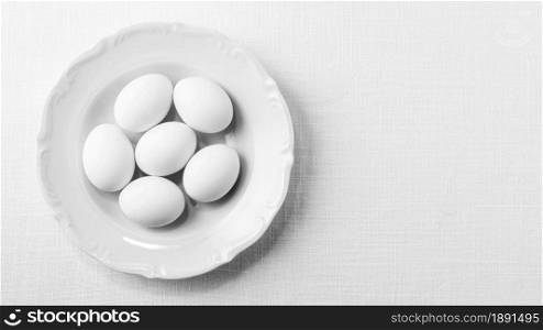 top view white eggs plate with copy space. Resolution and high quality beautiful photo. top view white eggs plate with copy space. High quality and resolution beautiful photo concept