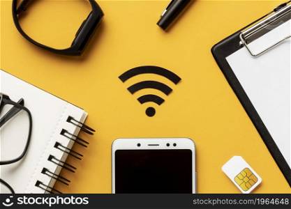 top view wi fi symbol with smartphone sim card. High resolution photo. top view wi fi symbol with smartphone sim card. High quality photo