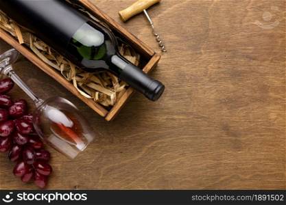 top view wine bottle glass with grapes copy space. Resolution and high quality beautiful photo. top view wine bottle glass with grapes copy space. High quality and resolution beautiful photo concept