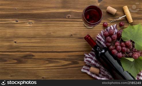 top view wine bottle with glass wooden background