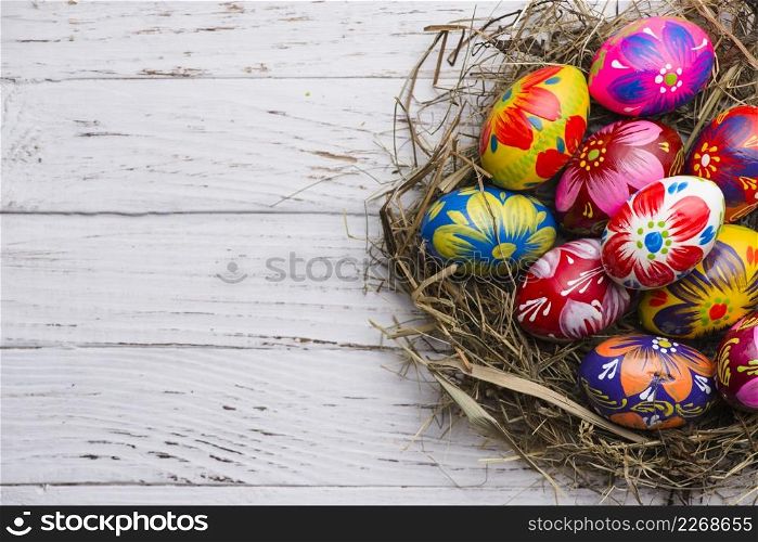 top view wooden surface with painted easter eggs