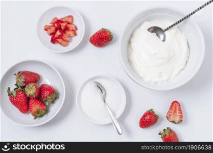 top view yogurt bowls with strawberries table. High resolution photo. top view yogurt bowls with strawberries table. High quality photo