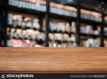 Top wooden table in coffee shop blurred background with bokeh