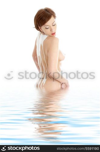 topless girl with soap foam on spine standing in water