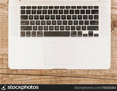 topview laptop keyboard wooden background. High resolution photo. topview laptop keyboard wooden background. High quality photo