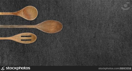 Topview of Set Cooking Wooden Utensils on Dark Background