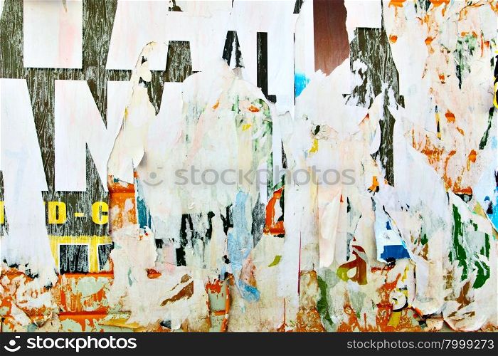 Torn advertisement posters, may be used asbackground