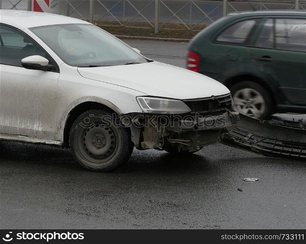 torn bumper accident on the road