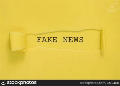 torn fake news paper yellow wall. High resolution photo. torn fake news paper yellow wall. High quality photo