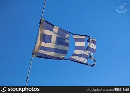 Torn greece flag waving on the wind&#xA;