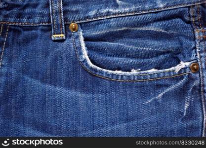 Torn jeans pocket denim background texture. Blue jeans fabric closeup as material
