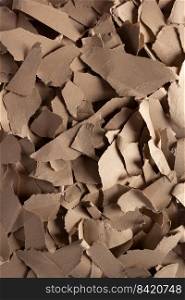 Torn paper heap as background texture. Recycling concept and waste cardboard