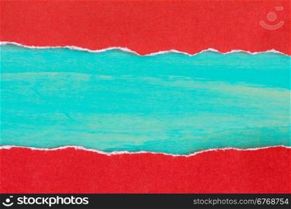 Torn red paper with a blue wooden background for your text