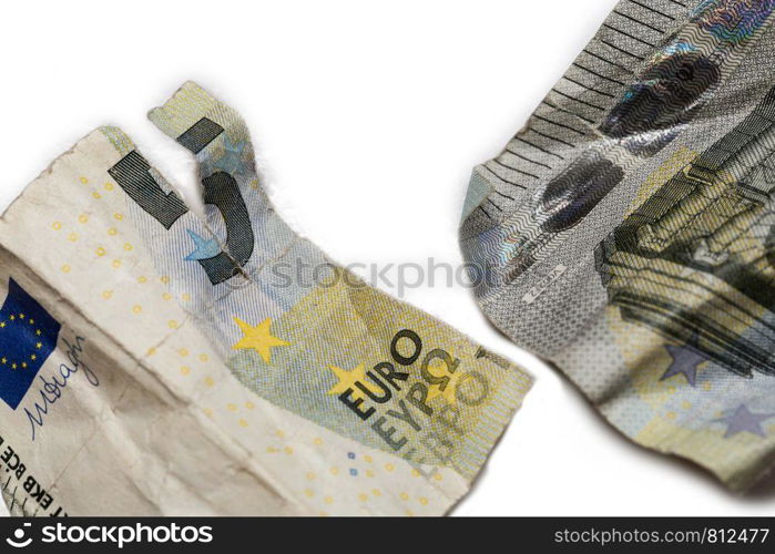 torn ripped money, real broken five euro bill isolated on white close-up. torn ripped money, real broken five euro bill isolated on white