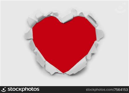Torn white paper heart over red background with copy space for text, Valentine&rsquo;s day love concept. Torn paper heart