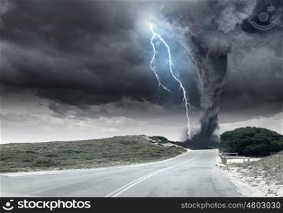 Tornado. Black tornado funnel and lightning on road