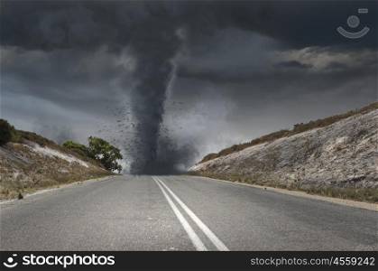 Tornado on road. Image of powerful huge tornado twisting on road