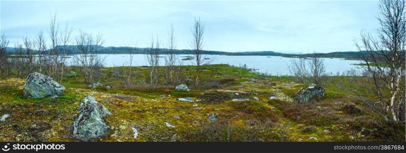 Tornetrask lake summer cloudy view ( Lapland, Norrbotten County in Sweden). Panorama.