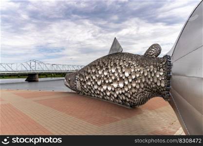 Tornio, Finland - 24 July, 2021  view of the anniversary celebration sculpture of a large metal salmon in the city center of Tornio