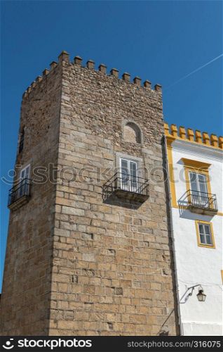 Torre das Cinco Quinas on the The Palace of the Dukes of Cadaval is located in Evora historic centre, in Portugal, facing the Roman Temple of Evora.