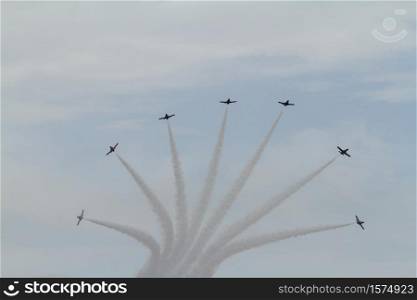 TORRE DEL MAR, MALAGA, SPAIN-JUL 31: Aircraft CASA C-101 of the Patrulla Aguila taking part in a exhibition on the 1st airshow of Torre del Mar on July 31, 2016, in Torre del Mar, Malaga, Spain. Aircraft CASA C-101 of the Patrulla Aguila