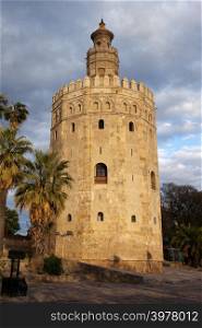 Torre del Oro (Gold Tower) at sunset, medieval landmark from early 13th century in Seville, Spain, Andalusia region.