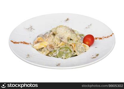 Tortellini with vegetables on white plate on white background