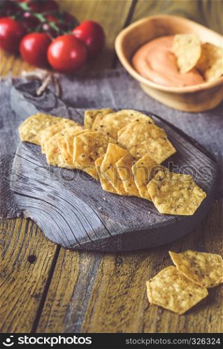 Tortilla chips with chile con queso - dip made of melted cheese and chilli pepper