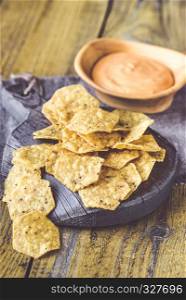 Tortilla chips with chile con queso - dip made of melted cheese and chilli pepper