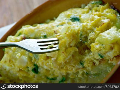 Tortilla de Bacalao.Spanish tortilla with vegetables and cod.