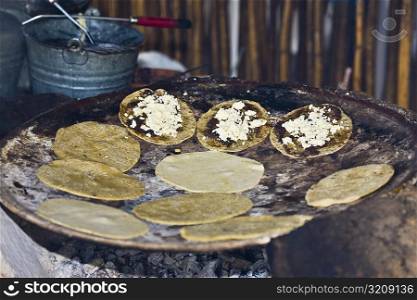 Tortilla preparing on the griddle, Santo Tomas Jalieza, Oaxaca State, Mexico