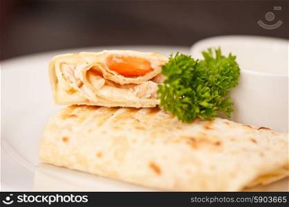 tortilla . tortilla with chicken breast tomato and cheese served with sour cream