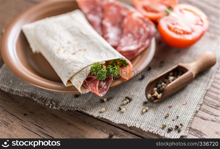 Tortilla with sausage and tomatoes