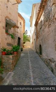 Tossa de Mar. The traditional city street.. Traditional narrow street in the old fortress in Tossa de Mar