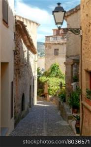Tossa de Mar. The traditional city street.. Traditional narrow street in the old fortress in Tossa de Mar