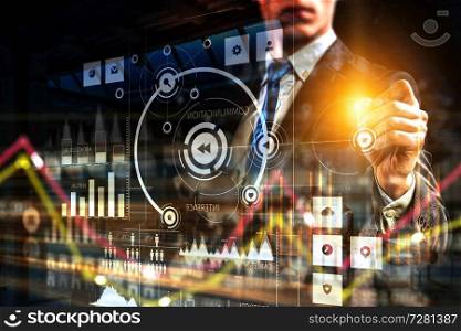 Touchscreen with business digital chart, graphs, schemes, tech images, icons, settings, network, digits and a man touching the screen with his hand. Digital chart on a touchscreen with a man touching by his hand
