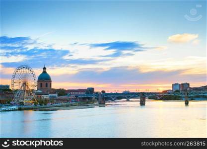 Toulouse landmarks on the bank of river Garone at sunset. France