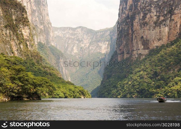 Tour Boats In Sumidero Canyon Chiapas. Tour boats and tourists travel through the Sumidero Canyon Chiapas, Mexico