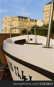 Tourboat with buildings in the background, Biarritz, Basque Country, Pyrenees-Atlantiques, Aquitaine, France