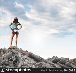 Tourism concept. Rear view of young woman in short dress