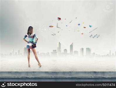 Tourism concept. Rear view of young woman in short dress