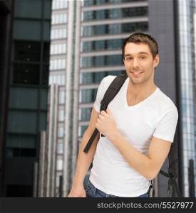 tourism, education and vacation concept - travelling student with backpack outdoor