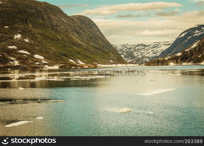 Tourism holidays and travel. Lake in mountains, Norway Scandinavia.. lake in norwegian mountains