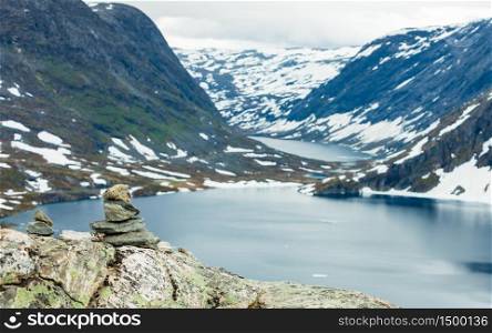 Tourism holidays and travel. Stones stack on Djupvatnet lake in Stranda More og Romsdal, Norway Scandinavia.. Djupvatnet lake, Norway