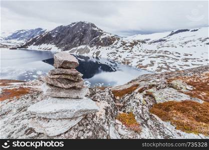 Tourism holidays and travel. Stones stack on Djupvatnet lake in Stranda More og Romsdal, Norway Scandinavia.. Djupvatnet lake, Norway
