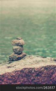 Tourism holidays and travel. Stones stack on lake shore, Norway Scandinavia.. Stones stack on lake shore, Norway