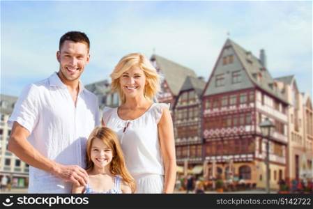 tourism, travel and people concept - happy family over frankfurt am main city background. happy family over frankfurt am main background