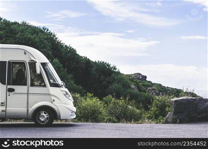 Tourism vacation and travel. C&er van and rocky coast landscape of southern Norway with an ocean view in Rogaland county Norway.. C&er car on coast of Norway with ocean view
