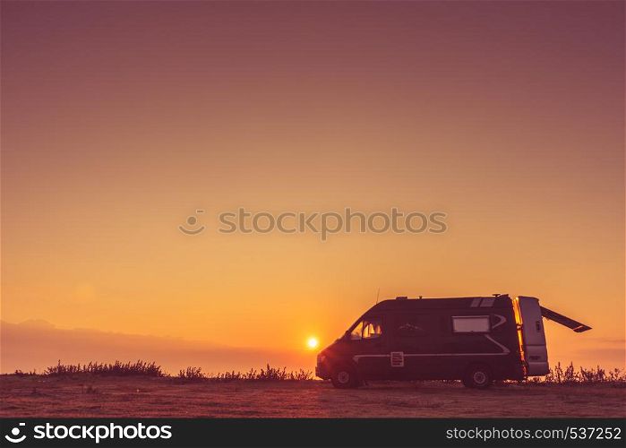 Tourism vacation and travel. Camper van and morning landscape at sunrise in Greece. Camper car on nature at sunrise