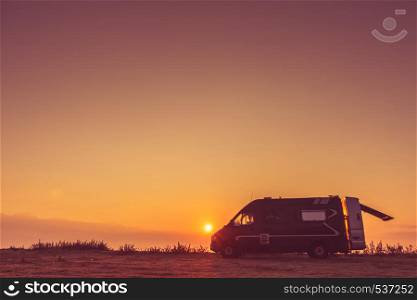 Tourism vacation and travel. Camper van and morning landscape at sunrise in Greece. Camper car on nature at sunrise
